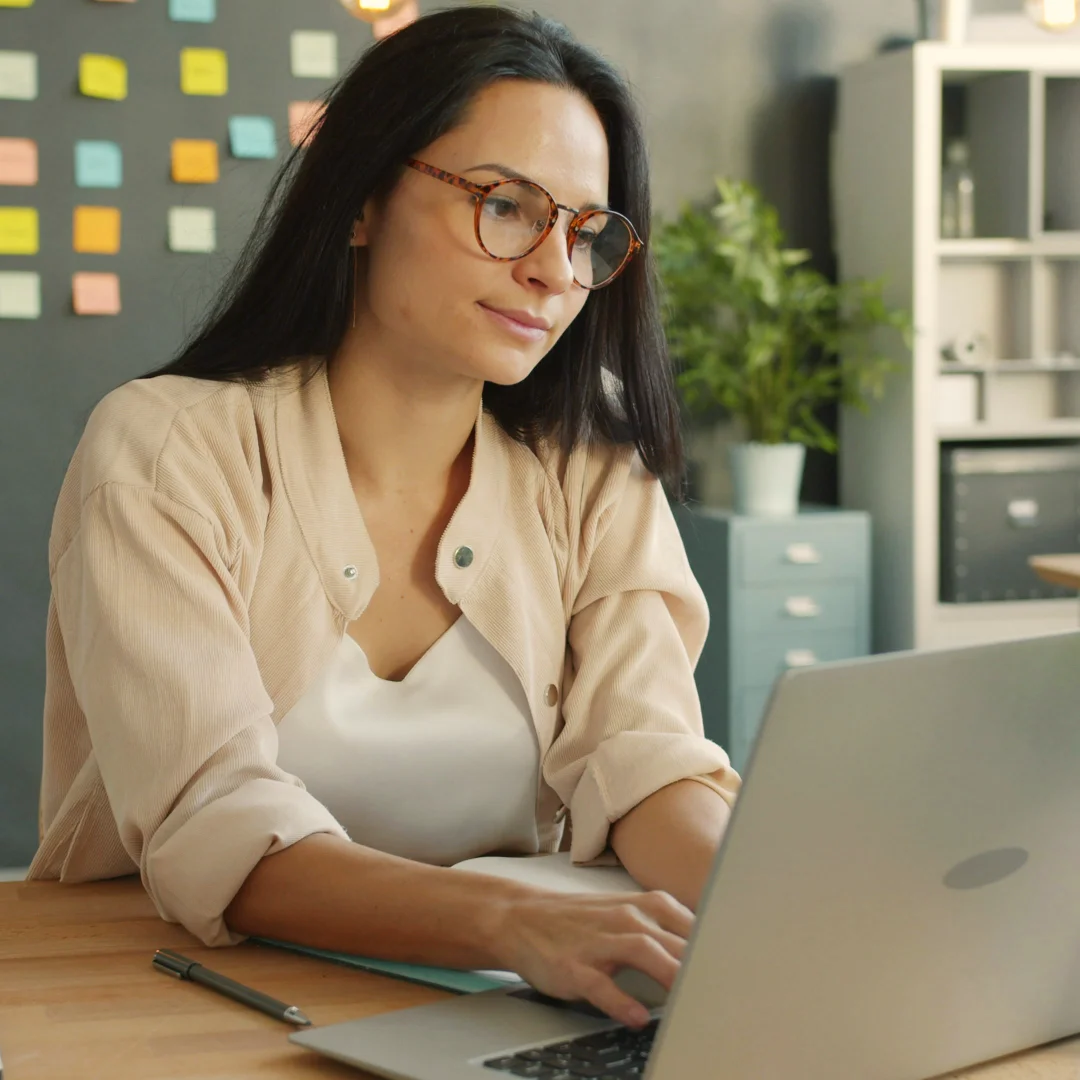Female senior executive working on a computer
